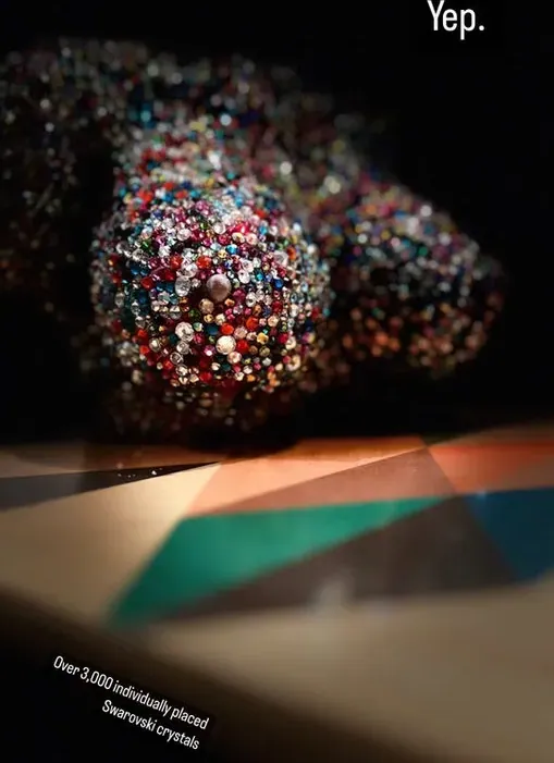 Rhinestone heel lit in the dark with the caption Yep