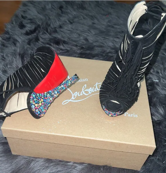 Louboutin heels with rhinestone-covered heels on the box