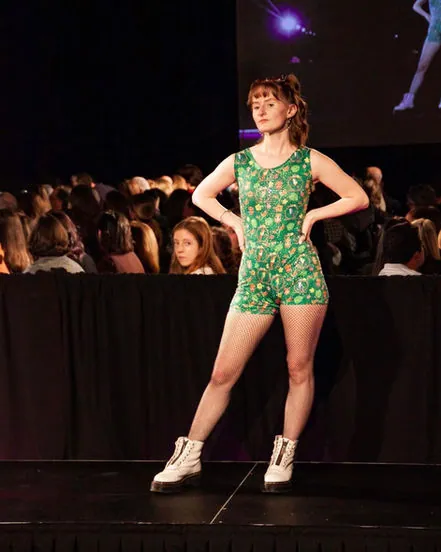 Green floral romper, hands on hips