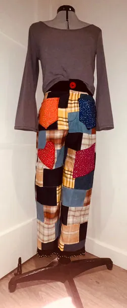 Patchwork pants with a long-sleeve top on a dress form