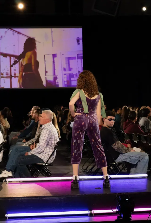Back view of the purple velvet jumpsuit