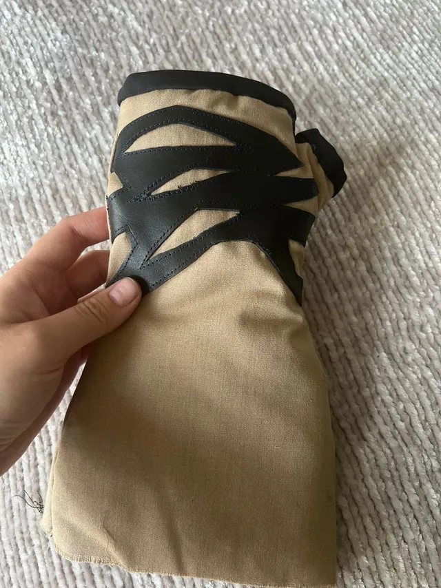 Khaki heated cuff with black zigzag heating panels