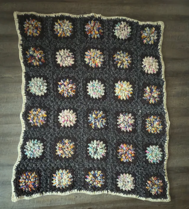 Charcoal blanket with multicolor flower squares