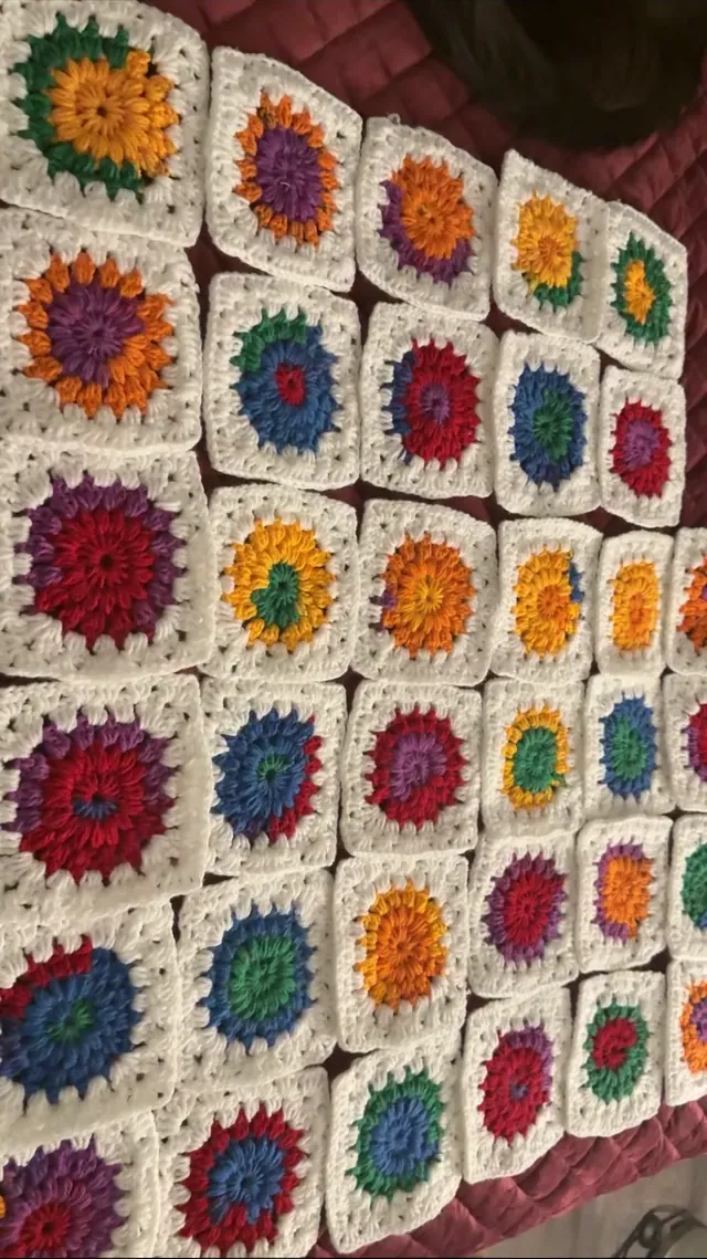 White blanket with rainbow flower squares