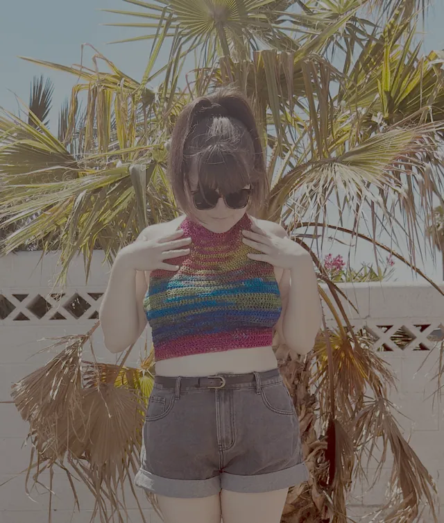 Rainbow crochet crop top worn outdoors